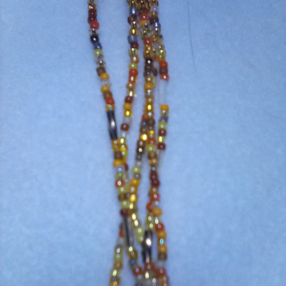 Hand Craft 5 Strand Multi orange colored beaded necklaces with a brown heart...